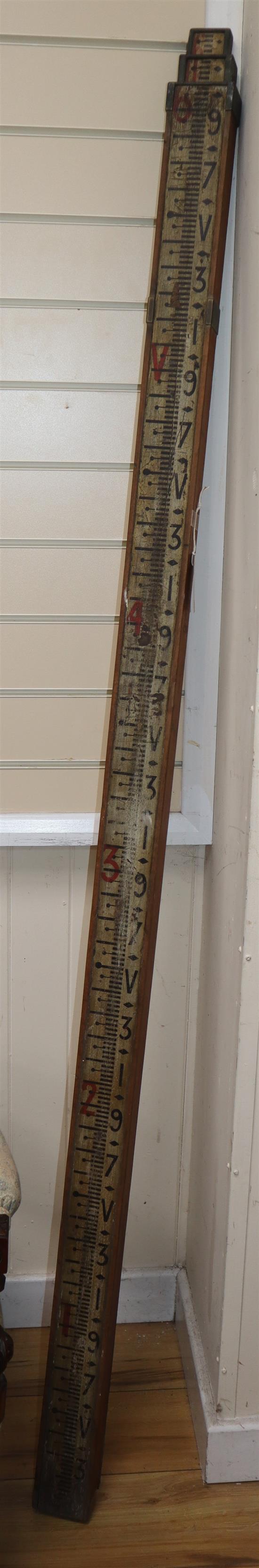 A vintage telescopic surveyors measure inscribed Stepney Estate